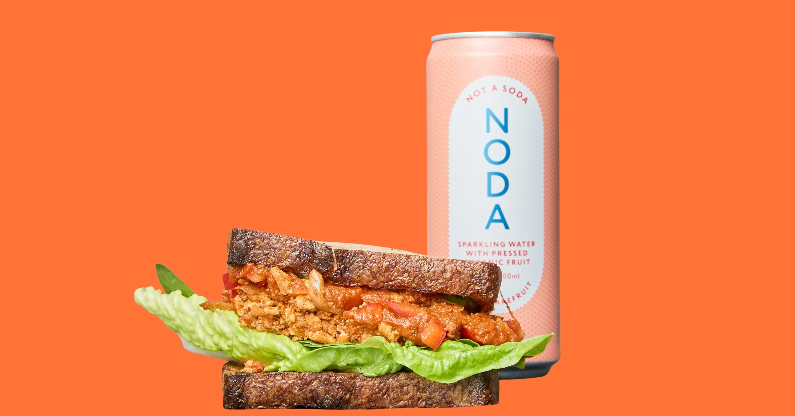 Vegan deli sandwich with NODA sparkling drink